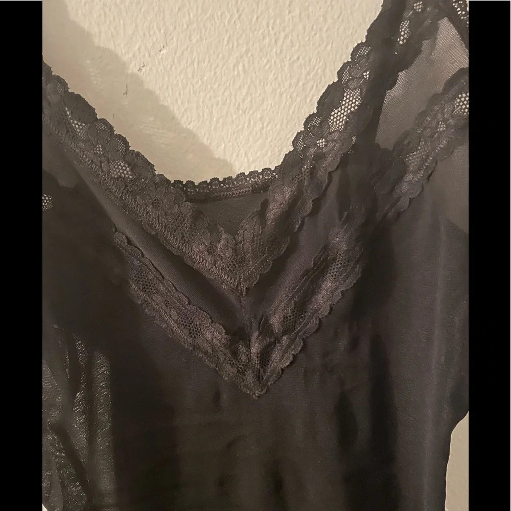 Sheer black negligeé with lace trim